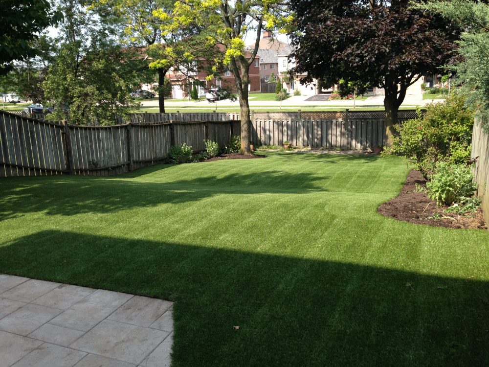 Large rolling yard makes for a lot of mowing. No more with artificial grass