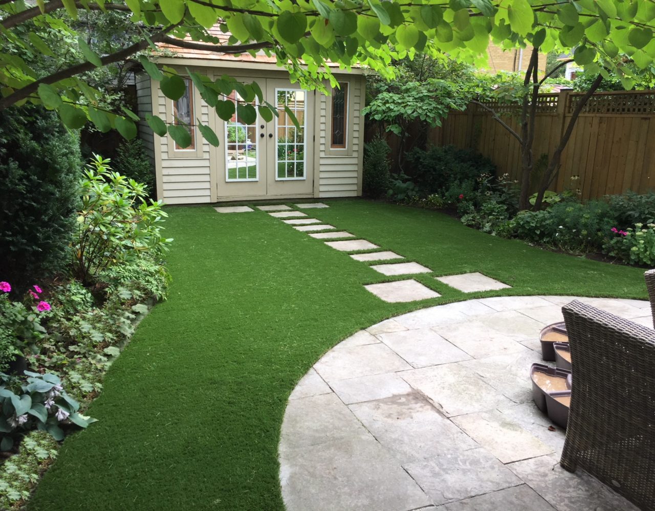 Flagstone path adds natural look around artificial grass