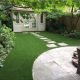 Flagstone path adds natural look around artificial grass
