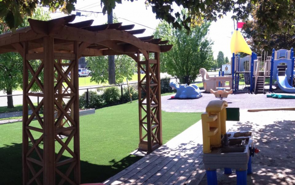 Oshawa daycare with artificial grass providing clean soft surface for kids playing