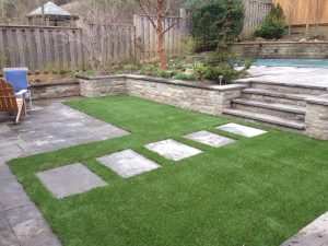 Pathway in artificial grass to upper deck 