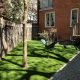minimalist yard with artificial grass with focus on art