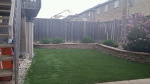 Raised garden beds and synthetic grass