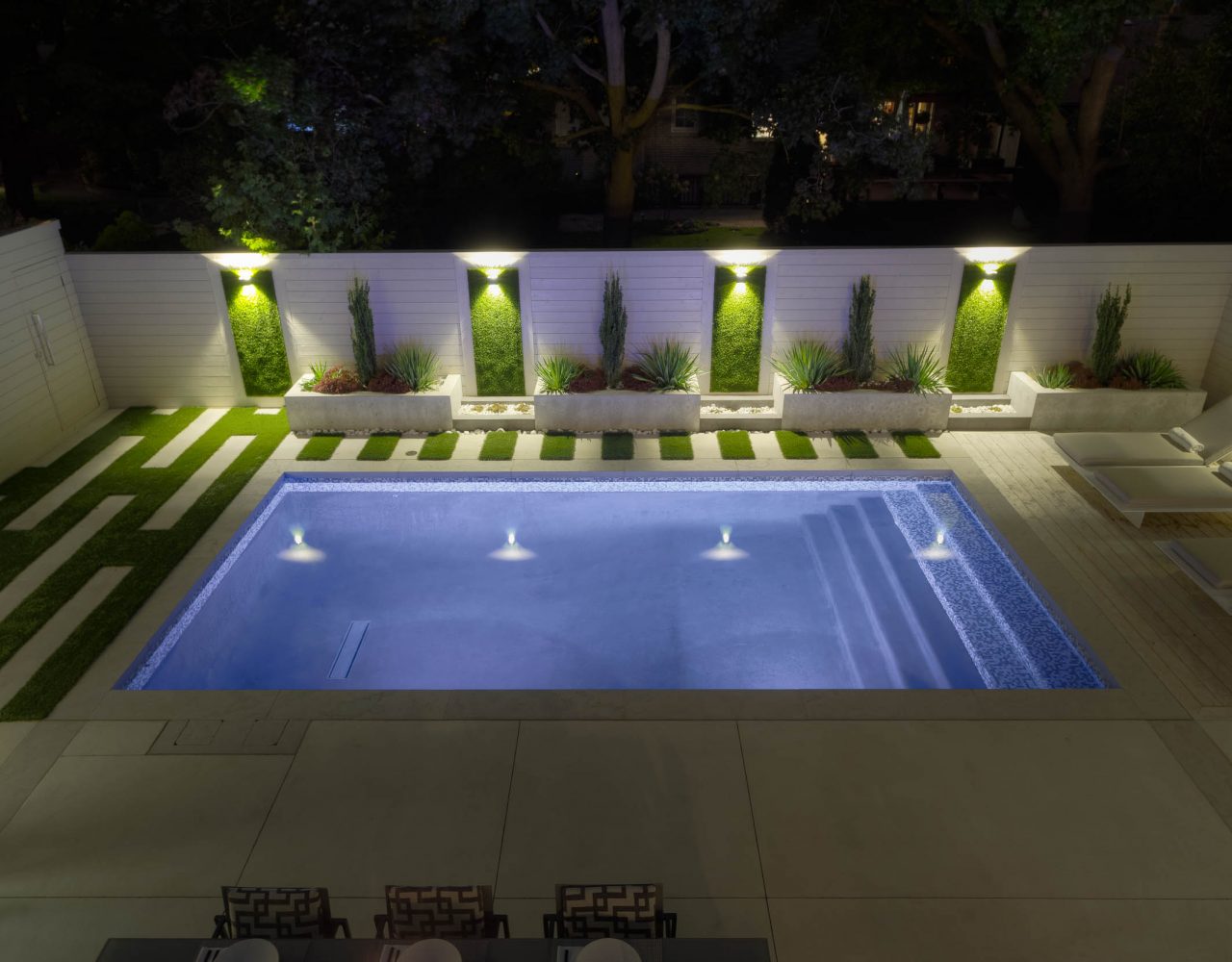 artificial grass walls lit with night lighting