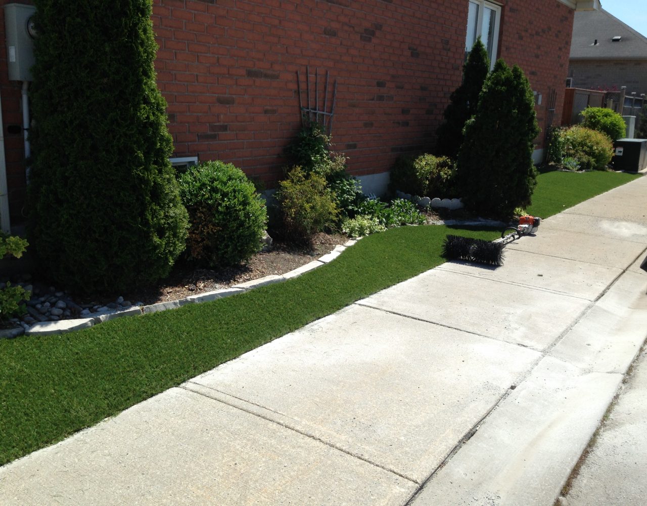 Artificial grass alongside sidewalks