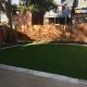 artificial grass framed with flagstone