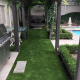 Beautiful pergola shades the artificial grass for total comfort