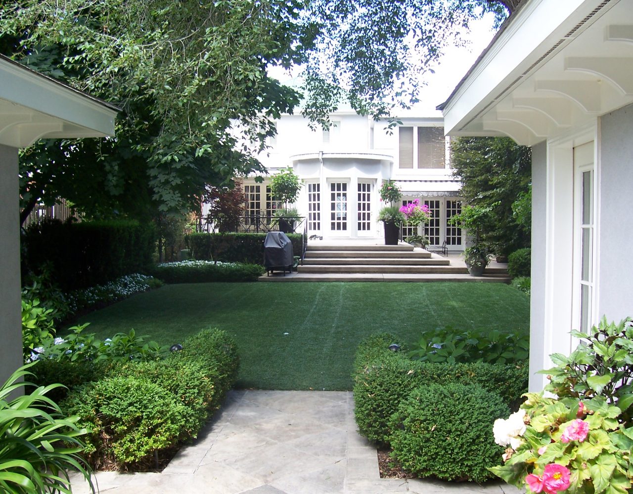 immaculate backyard with formal gardens
