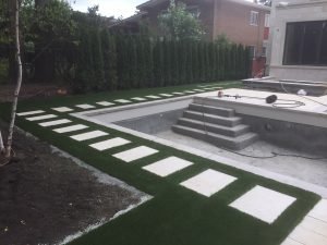 Artificial grass makes this Toronto backyard immaculate to match landscape