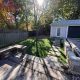 Cedar deck paver path bordered with grass